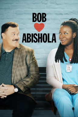 Bob Hearts Abishola: Season 2 - Billy Gardell and Folake Olowofoyeku looking at each other on bench